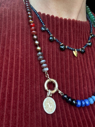 Beaded necklace with a holy mary pendant on a vampire's wife dress