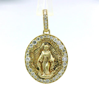 Gold and diamond Miraculous medal with religious design on a white background
