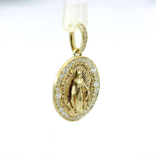 Gold and diamond holy mother pendant with religious design on a white background