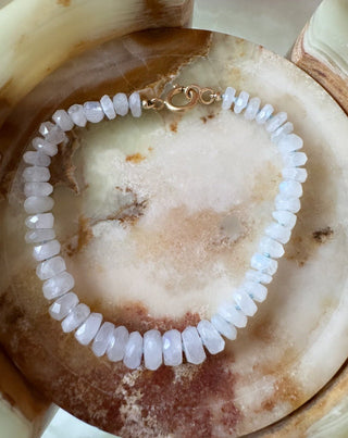 Close-up of moonstone gemstones knotted for new mother gift bracelet