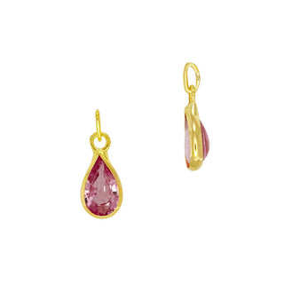 Gold earring charm with pink sapphire on a white background