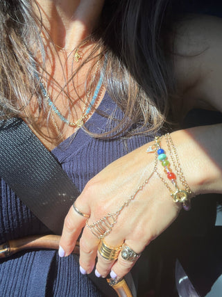 Aaron's Breastplate bracelet with twelve gemstones hand-knotted on silk, vintage gold chain and diamond charm.