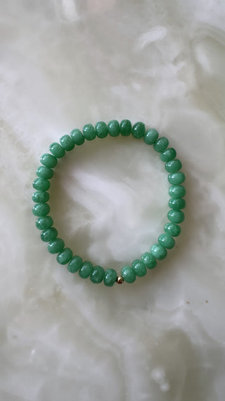Angelite stretch bracelet with 14k gold bead, waterproof stretchy design.