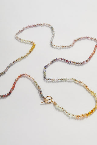 Appalachian Sapphire pullover necklace, hand-knotted sapphires on silk with a 14k gold toggle clasp.