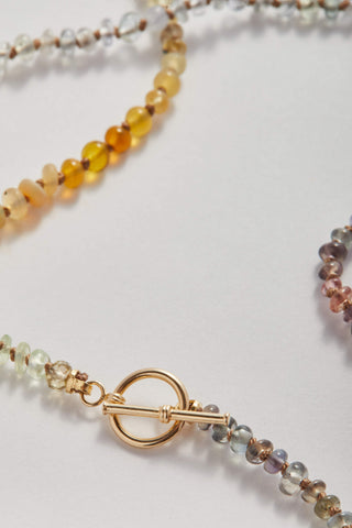 Appalachian Sapphire pullover necklace, hand-knotted sapphires on silk with a 14k gold toggle clasp.