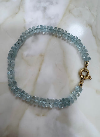 Aquamarine bracelet, gemstones knotted on silk thread with a solid 18k gold clasp.