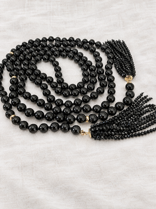 Black Onyx Beaded Lariat Necklace with a faceted spinel fringe and 9k gold, hand-knotted on silk by Sorsa Jewellery.