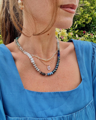 Blue Rainbow necklace, mixed gemstone beads knotted on silk with a 9k gold bolt clasp.