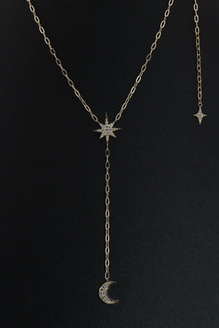 Celestial Moon Drop Necklace by Sorsa Jewellery, a diamond starburst falling to a crescent moon on a 9k gold oval rollo chain.