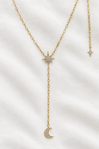Celestial Moon Drop Necklace by Sorsa Jewellery, a diamond starburst falling to a crescent moon on a 9k gold rollo chain.