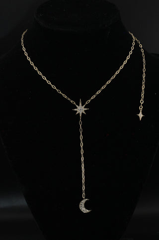 Celestial Moon Drop Necklace by Sorsa Jewellery, a diamond starburst falling to a crescent moon on a 9k gold oval rollo chain.