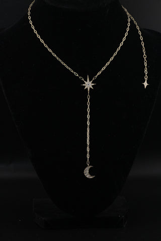 Celestial Moon Drop Necklace by Sorsa Jewellery, a diamond starburst falling to a crescent moon on a 9k gold oval rollo chain.