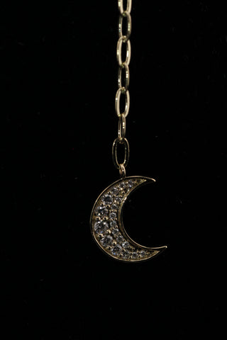 Celestial Moon Drop Necklace by Sorsa Jewellery, a diamond starburst falling to a crescent moon on a 9k gold oval rollo chain.