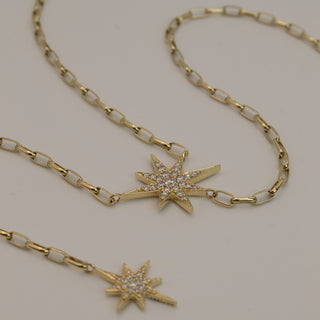 Celestial Starburst Drop Necklace by Sorsa Jewellery, pavé diamond starbursts on a 9k gold oval rollo chain.