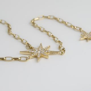 Celestial Starburst Drop Necklace by Sorsa Jewellery, pavé diamond starbursts on a 9k gold oval rollo chain.