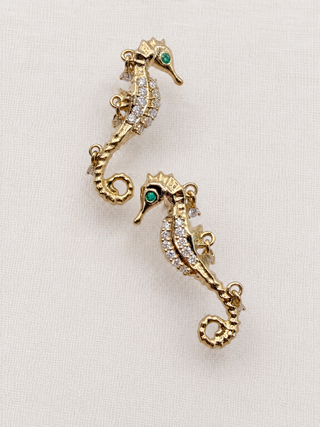 Gold seahorse earring with emerald and pavé diamonds, by Sorsa Jewellery.