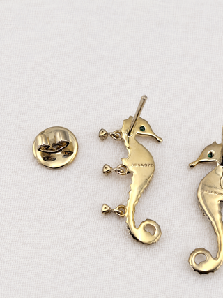 Diamond Seahorse stud earring in 9k gold with emerald eye, by Sorsa Jewellery.
