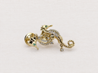 Seahorse earring in 9k gold with emeralds and diamonds, by Sorsa Jewellery.