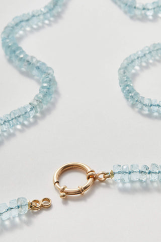 Faceted Aquamarine necklace, hand-knotted aquamarine beads on silk with a 14k gold bolt clasp.