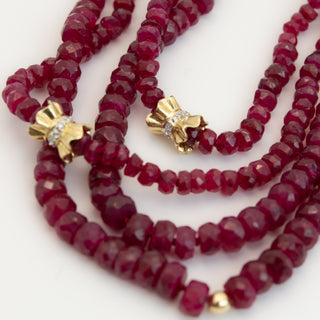 Faceted ruby wrap necklace on silk with 14k gold pave diamond bow details, no clasp.
