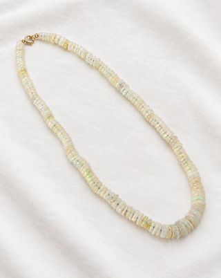 Side view of the Graduated Opal Heishi Necklace with 9k gold, by Sorsa Jewellery.