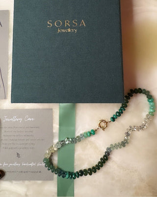 Green Rainbow gemstone necklace by Sorsa Jewellery, tonal green gemstones hand-knotted on silk with a 9k gold bolt clasp, designed in collaboration with Matilda Goad