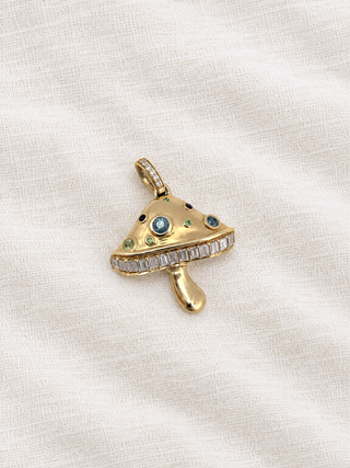Magic Mushroom charm in 9k gold with baguette diamonds and sapphires, by Sorsa Jewellery.