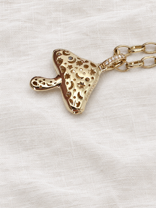 Back view of the Magic Mushroom diamond charm in 9k gold, by Sorsa Jewellery.