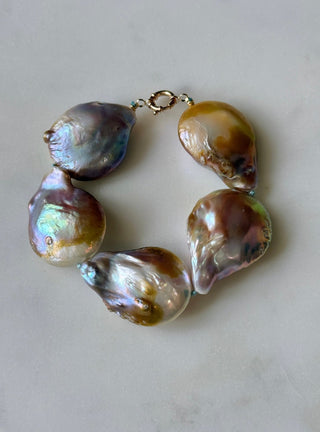 Mermaid Dreams bracelet, pink baroque pearls knotted on silk with a 14k gold bolt clasp.