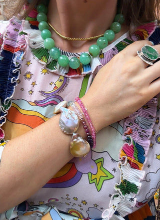Mermaid Dreams bracelet, pink baroque pearls knotted on silk with a 14k gold bolt clasp.
