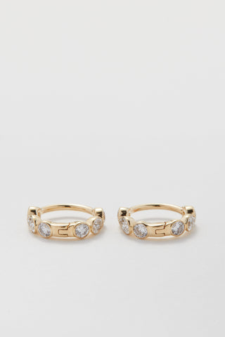 Mini pear and round diamond huggie hoops in 9ct recycled gold, 7mm inner diameter.