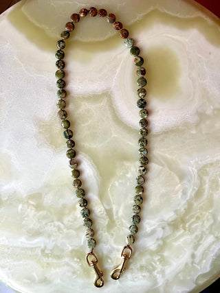 Mossy Autumn Floor bag strap, rhyolite beads knotted on mocha silk with a brass trigger clip.