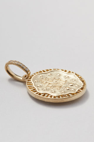 The Mother Miraculous Medal diamond charm in matte 9k recycled gold, Madonna design.