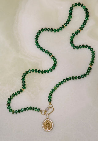 The Mother Miraculous Medal diamond charm in matte 9k recycled gold, Madonna design.