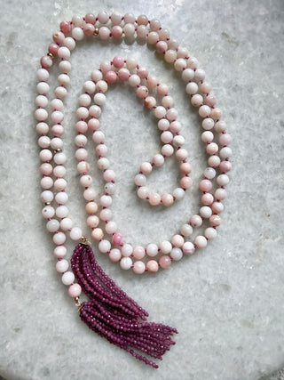 Peruvian pink opal lariat necklace with a cascading ruby fringe and 9K gold cup accents.