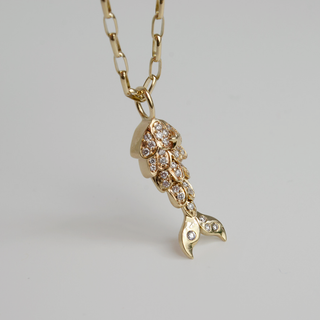 Diamond Mermaid Tail Charm in 9k recycled gold with pave lab-grown diamonds, petite and full-size versions.
