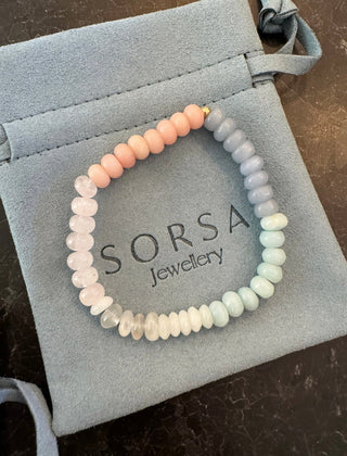 Pink Clouds Stretch Bracelet, hand-strung stretchy gemstones finished with a 14k gold bead.