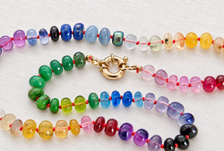 River Cafe Rainbow Gemstone Necklace with 9K Gold, hot pink and blue gemstones hand-knotted on silk.