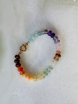 Sorsa Rainbow bracelet, mixed gemstones knotted on silk with a 14k gold bolt ring clasp.