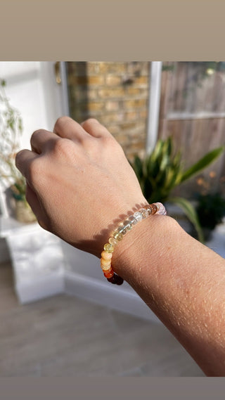 Sorsa Rainbow bracelet, mixed gemstones knotted on silk with a 14k gold bolt ring clasp.