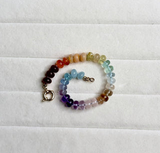 Sorsa Rainbow bracelet, mixed gemstones knotted on silk with a 14k gold bolt ring clasp.
