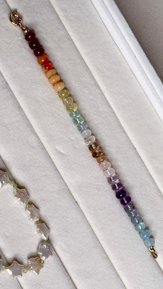 Sorsa Rainbow bracelet, mixed gemstones knotted on silk with a 14k gold bolt ring clasp.