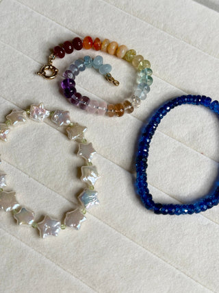 Sorsa Rainbow bracelet, mixed gemstones knotted on silk with a 14k gold bolt ring clasp.