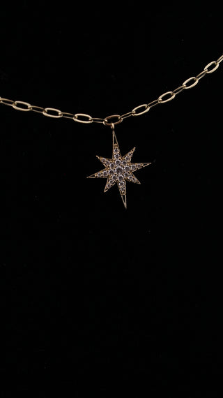 Star Dust Necklace by Sorsa Jewellery, five diamond-set starbursts on a rollo link 9k gold chain.