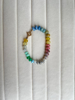 Summer Candies Rainbow bracelet, mixed gemstones knotted on silk with an 18k gold bolt ring clasp.