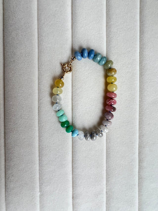 Summer Candies Rainbow bracelet, mixed gemstones knotted on silk with an 18k gold bolt ring clasp.
