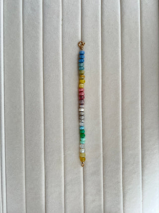 Summer Candies Rainbow bracelet, mixed gemstones knotted on silk with an 18k gold bolt ring clasp.