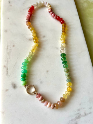 Summer Sunsets necklace, mixed gemstones knotted on silk with a 14k gold diamond charm holder clasp.