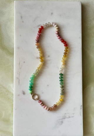 Summer Sunsets necklace, mixed gemstones knotted on silk with a 14k gold diamond charm holder clasp.