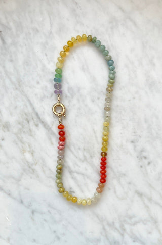 Summer Sunsets Rainbow gemstone necklace by Sorsa Jewellery, peach and citrus toned gemstones hand-knotted on silk with a 9k gold bolt clasp, designed in collaboration with Genevieve Harris